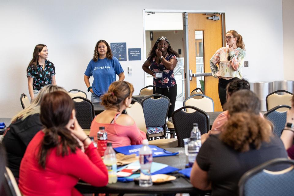 From left, Kaselyn Counterman, Sydney Mood, Sally Uzomba and Madison Adkins, Texas A&M University-Corpus Christi students in the Supervised Independent Living program, speak to a group of foster care youths on Wednesday, June 15, 2022.