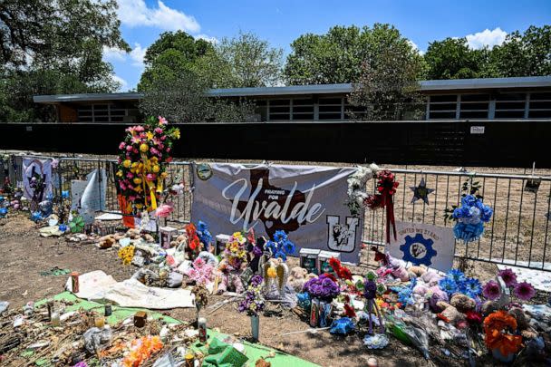 PHOTO: Mementos decorate a makeshift memorial to the victims of a shooting at Robb Elementary School in Uvalde, Texas, June 30, 2022. (Chandan Khanna/AFP via Getty Images)