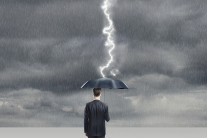 Lightning Striking Man Carrying Umbrella