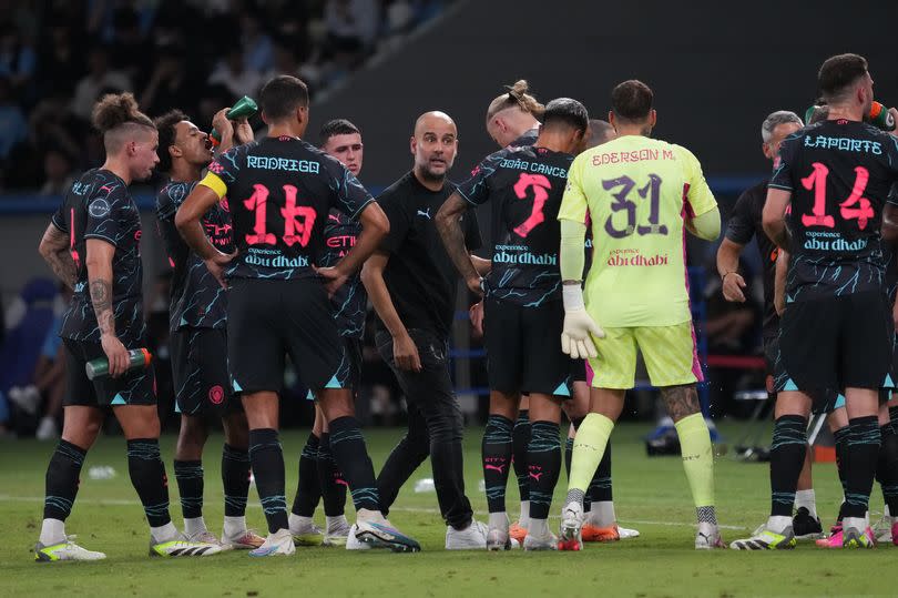 Guardiola talks to his players