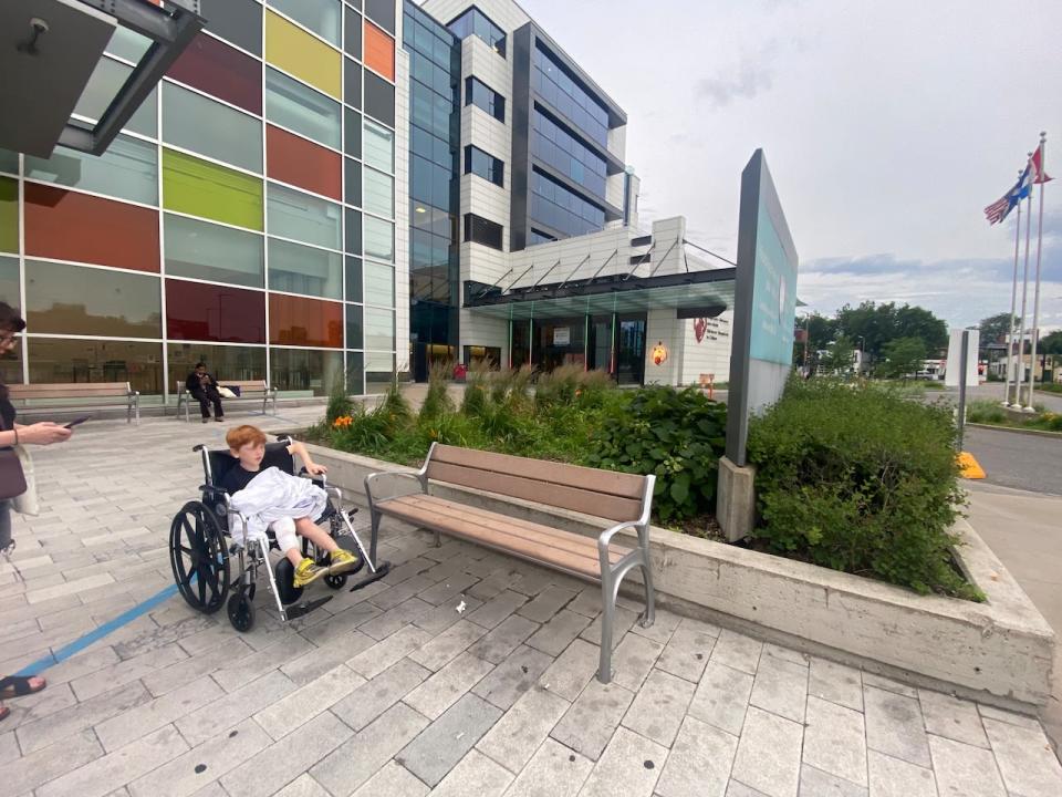 Max Mandl sits in a wheelchair outside the Montreal Children's Hospital. He needed two stitches as a result of his injury.