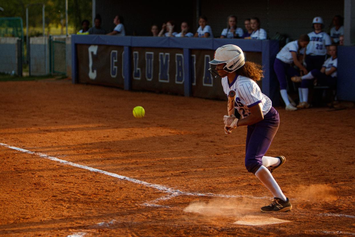 Columbia Central Lions Saviya Morgan (23) bunts and runs for first during a game against Ravenwood High School at Columbia Central in Columbia, Tenn. on Apr 18, 2023. 