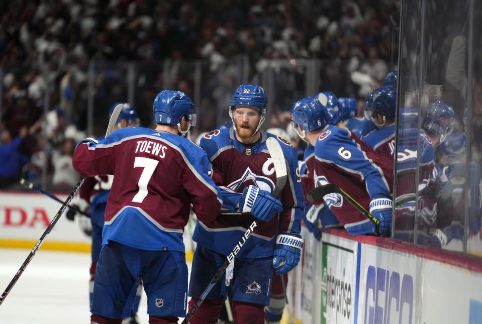 Colorado Avalanche left wing Gabriel Landeskog (92) celebrates an empty-net goal against the Edmonton Oilers during the third period in Game 1 of the NHL hockey Stanley Cup playoffs Western Conference finals Tuesday, May 31, 2022, in Denver. (AP Photo/Jack Dempsey)