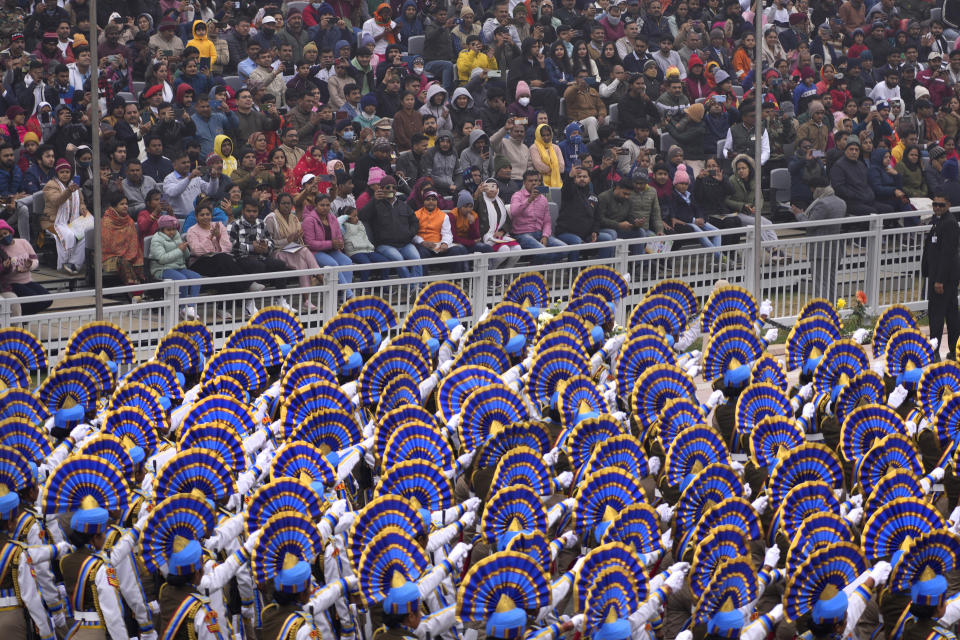 Indian defence forces march through the ceremonial Kartavya Path boulevard during India's Republic Day celebrations in New Delhi, India, Thursday, Jan. 26, 2023. Tens of thousands of people shed COVID-19 masks but faced morning winter chill and mist at a ceremonial parade in the Indian capital on Thursday showcasing India's defence capability and cultural and social heritage on a long revamped marching ceremonial boulevard from the British colonial rule.(AP Photo/Manish Swarup)