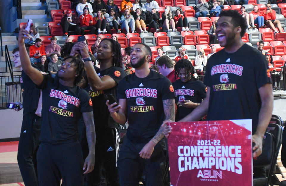 Jacksonville men's basketball team celebrates after it is announced the Gamecocks will be a 15 seed in the NCAA Tournament.