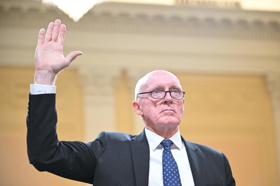 Arizona state House Speaker Rusty Bowers raises his right hand as he is sworn in before testifying.