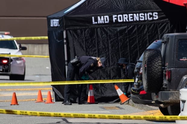 RCMP forensic officers are pictured at the scene of a fatal shooting outside of the Langley Sportplex in Langley, British Columbia on Wednesday, April 21, 2021. (Ben Nelms/CBC - image credit)