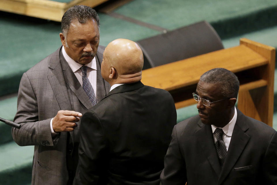 FILE - In this Monday, May 17, 2004 file photo, the Rev. Jesse Jackson, left, speaks with Rep. Elijah Cummings, D-Md., before a funeral for Freddie Gray at New Shiloh Baptist Church in Baltimore. Gray died from spinal injuries about a week after he was arrested and transported in a Baltimore Police Department van. (AP Photo/Patrick Semansky)