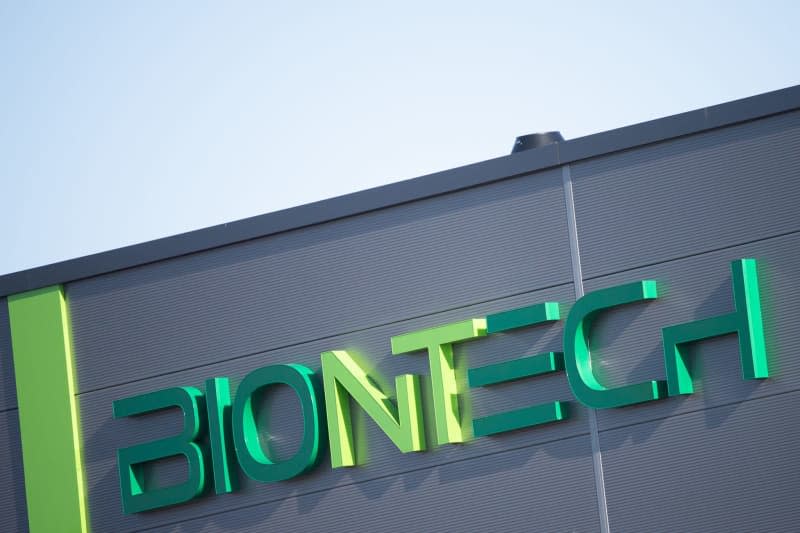 The Biontech logo can be seen on one of the company's warehouse buildings in Mainz. Sebastian Gollnow/dpa