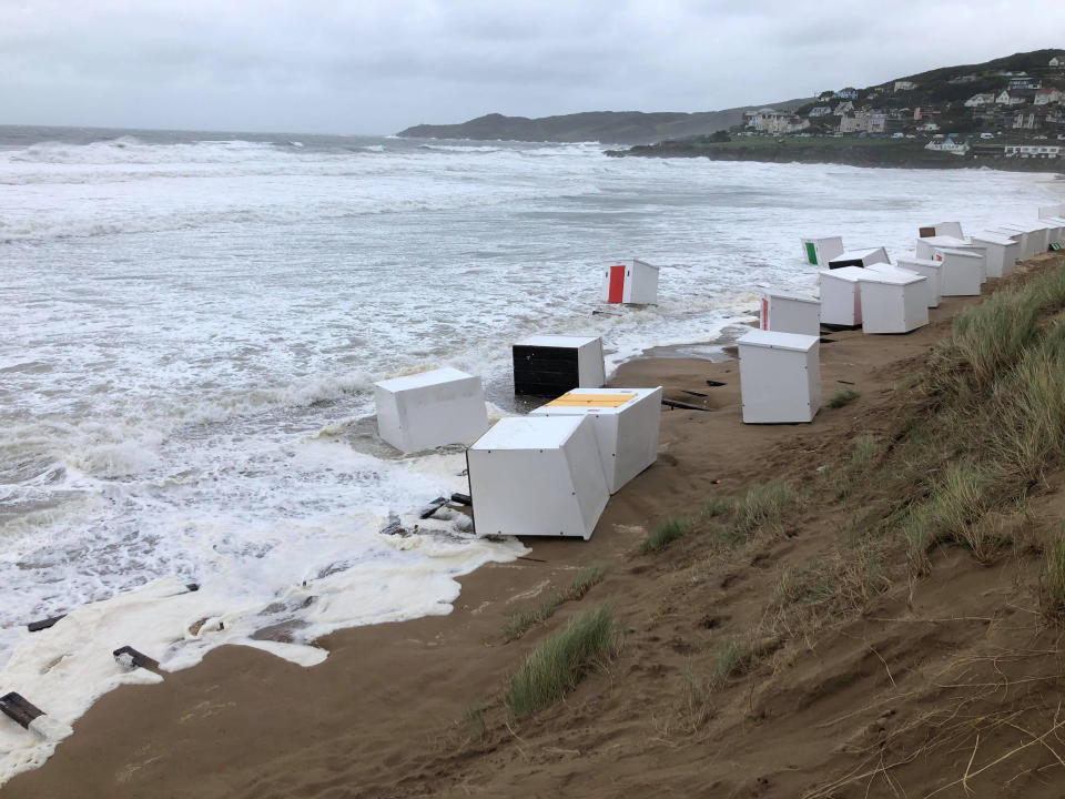 Several beach huts being washed into the sea as heavy winds battered Britain. See SWNS story SWPLhuts SWPLhuts; The huts washed into the sea at Woolacombe beach last night (Thurs) and were still bobbing around with the waves this morning 21 Aug 2020. Local resident Richard Walden said it was a scene of devastation. His pictures were taken as Britain woke up to the carnage caused by the arrival of Storm Ellen. The Met Office predicted wind gusts reaching speeds of over 50mph in places.