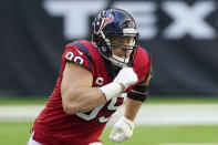 FILE - In this Dec. 6, 2020, file photo, Houston Texans defensive end J.J. Watt (99) rushes in during the second half of an NFL football game against the Indianapolis Colts in Houston. Watt and the Texans have “mutually agreed to part ways,” ending the tenure of the face of the franchise and adding another huge change to an offseason filled with upheaval. (AP Photo/David J. Phillip, File)