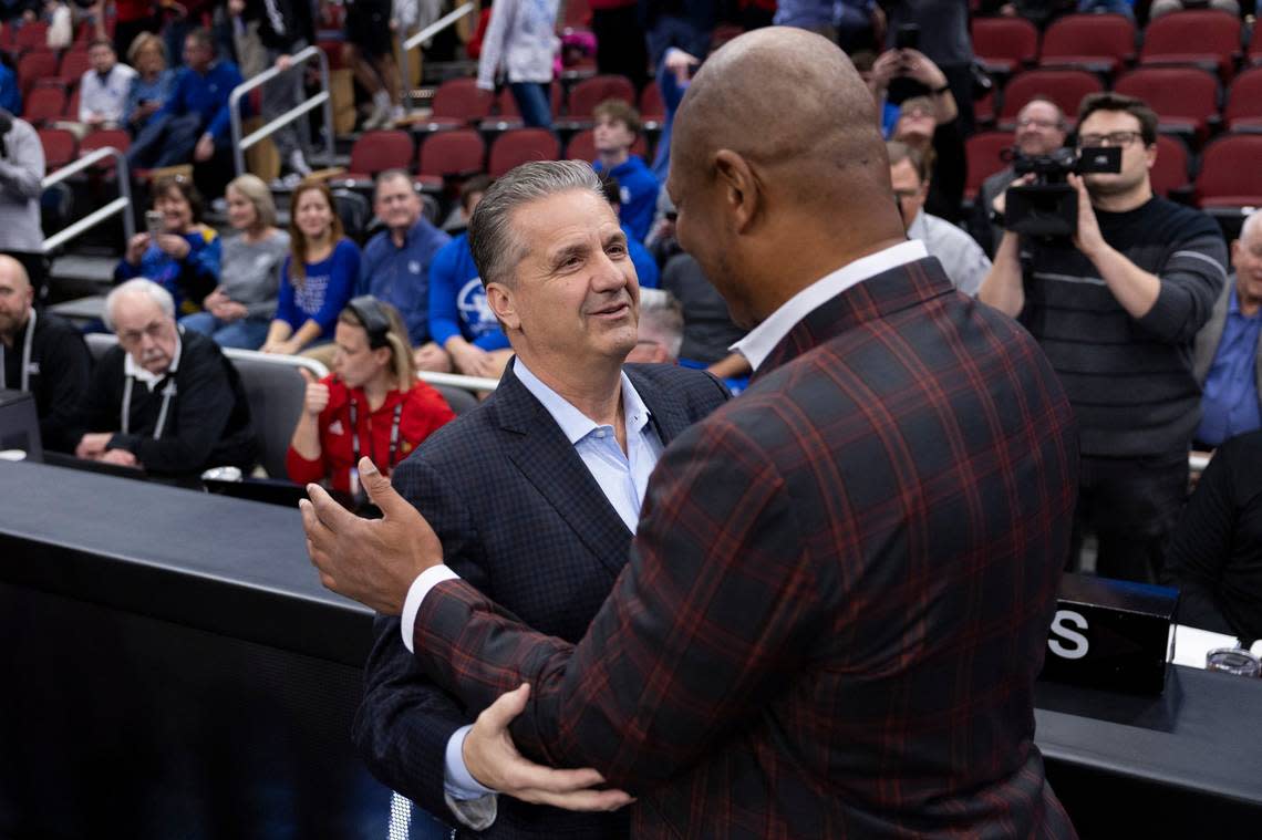 John Calipari, left, shakes hands with Kenny Payne before Kentucky defeated Louisville 95-76 at the KFC Yum Center on Dec. 21, 2023. In his 15 seasons as UK head man, Calipari went 13-3 against U of L.