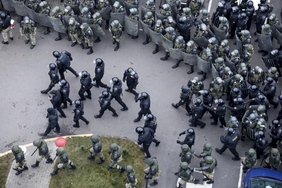 Belarusian riot police block the road to stop demonstrators during an opposition rally to protest the official presidential election results in Minsk, Belarus, Sunday, Nov. 15, 2020. A Belarusian human rights group says more than 500 people have been arrested in protests around the country calling for authoritarian President Alexander Lukashenko to step down. The Sunday demonstrations continued to wave of near-daily protests that have gripped Belarus since early August. (AP Photo)