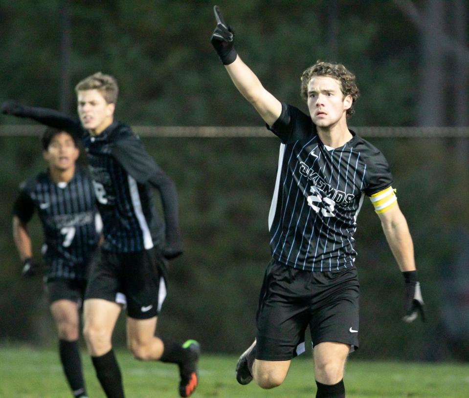Isaac Freidhoff celebrates his goal for Okemos in a 2-0 victory over Hartland in a district championship soccer game Thursday, Oct. 20, 2022.