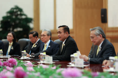 Thai Prime Minister Prayut Chan-o cha (second from the right) talks to Chinese President Xi Jinping (not pictured) during the bilateral meeting of the Second Belt and Road Forum at the Great Hall of the People on April 26, 2019 in Beijing, China. Picture taken April 26, 2019. Andrea Verdelli/Pool via REUTERS