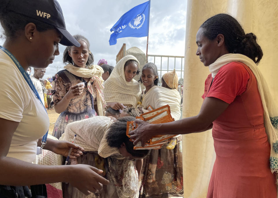 World Food Programme (WFP) workers screen for malnutrition and distribute food to communities in the Adi Daero district of the Tigray region of northern Ethiopia Saturday, Aug. 21, 2021. (Claire Nevill/WFP via AP)