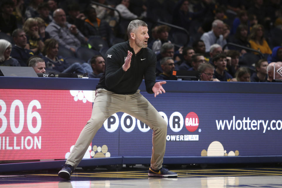 West Virginia coach Josh Eilert reacts during the second half of an NCAA college basketball game against Baylor Saturday, Feb. 17, 2024, in Morgantown, W.Va. (AP Photo/Kathleen Batten)