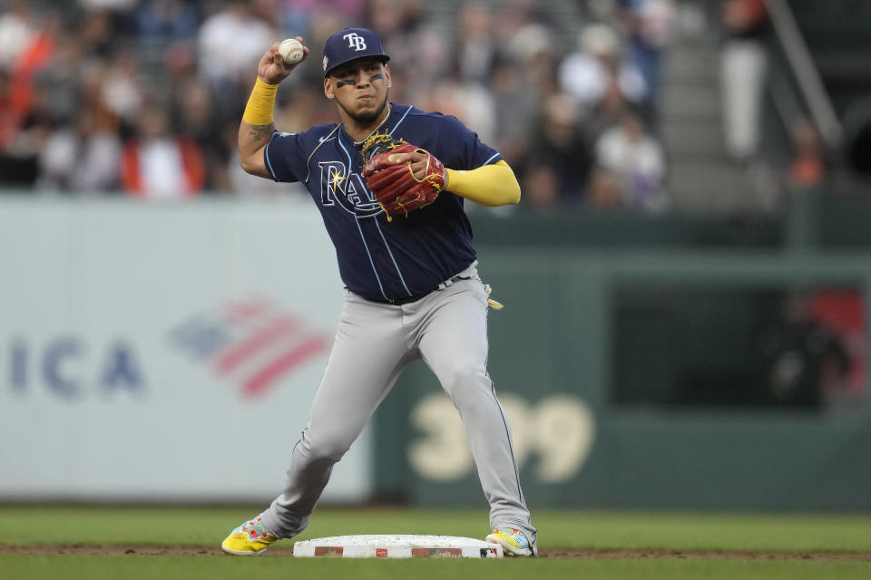 Tampa Bay Rays second baseman Isaac Paredes throws to first base on a double play hit into by San Francisco Giants' Thairo Estrada during the second inning of a baseball game in San Francisco, Monday, Aug. 14, 2023. (AP Photo/Jeff Chiu)