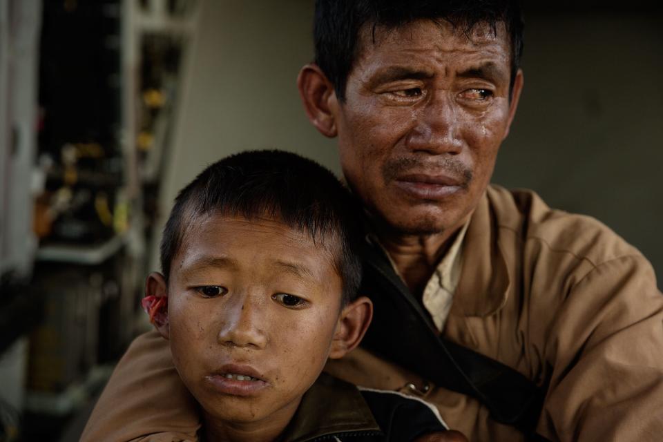 Nepal earthquake. Young Buddhist monks from Hinang Gompa (monastery) in the village of Lhi in Gorkha district in the Annapurna Range of the Himalayas were transported by Indian Army helicopter to Pokhara because the monastery was damaged in the earthquake. A boy was injured in the mountain village of Dhunchet and with his father was evacuated  by Indian Army helicopter. Mountain villages outside Pokhara that were destroyed. Food drops by Indian Army helicopters.  by James Nachtwey