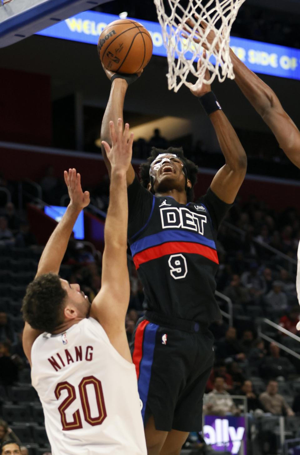 Detroit Pistons forward Ausar Thompson (9) goes to the basket against Cleveland Cavaliers forward Georges Niang (20) during the first half of an NBA basketball game Saturday, Dec. 2, 2023, in Detroit. (AP Photo/Duane Burleson)