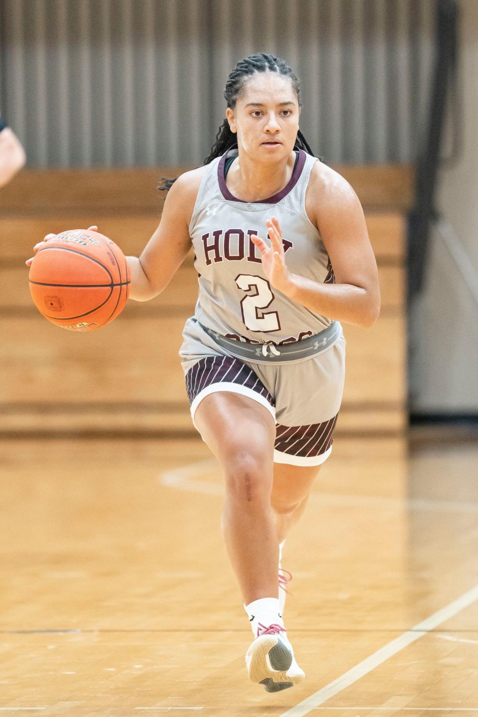 Former Penn player Jordyn Smith is part of a trio of former local prep talent helping the Holy Cross women's basketball team to new heights this season.