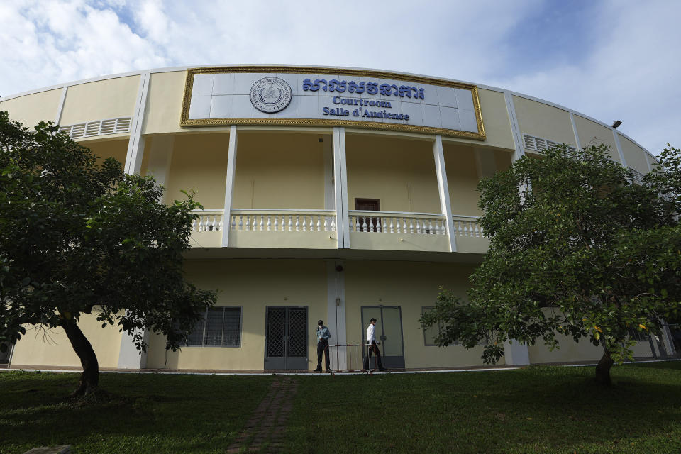 The sun rises on the court house where the hearings against Khieu Samphan, former Khmer Rouge head of state, are taking place in Phnom Penh, Cambodia, Thursday, Sept. 22, 2022. The tribunal will issue its ruling on an appeal by Khieu Samphan, the last surviving leader of the Khmer Rouge government that ruled Cambodia from 1975-79. He was convicted in 2018 of genocide, crimes against humanity and war crimes and sentenced to life in prison. (AP Photo/Heng Sinith)