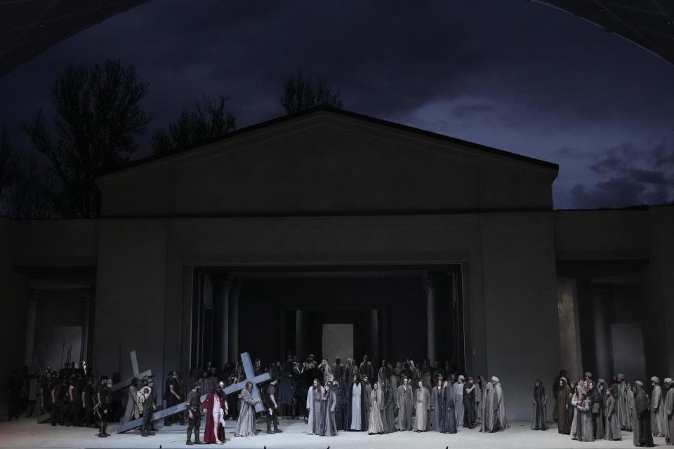 Rochus Rueckel as Jesus performs with cast members during the rehearsal of the 42nd Passion Play in Oberammergau, Germany, Wednesday, May 4, 2022. More than 1800 citizens of this Bavarian village participate in the century-old play of the suffering of Christ, staged every ten years and dating back to 1634. (AP Photo/Matthias Schrader)