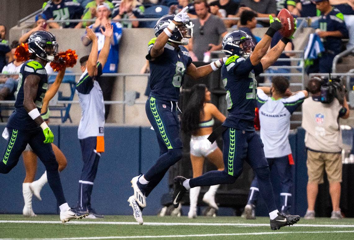 Seahawks rookie safety Joey Blount (35) jumps and celebrates after recovering an onside kick late in the team’s second preseason game at Lumen Field in Seattle on August 18, 2022.