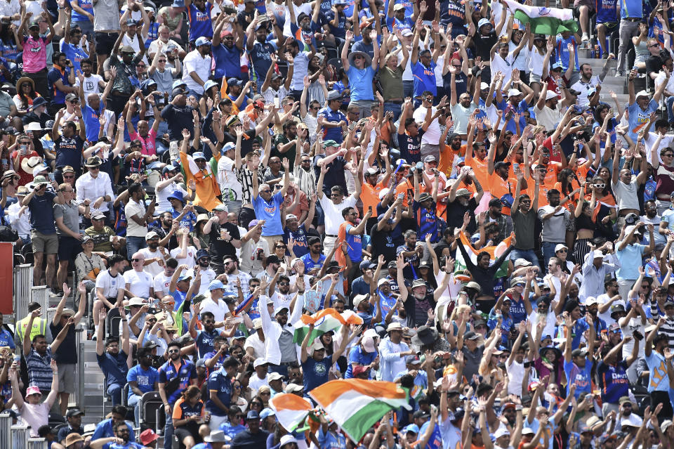 Fans enjoy a mexican wave during the third one day international cricket match between England and India at Emirates Old Trafford cricket ground in Manchester, England, Sunday, July 17, 2022. (AP Photo/Rui Vieira)