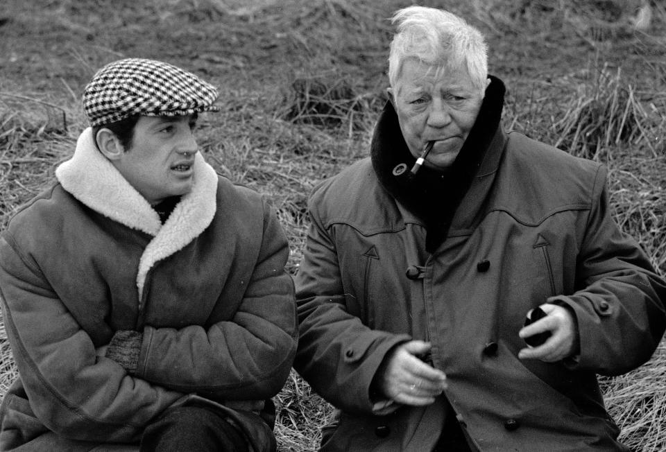 FILE - In this Jan. 26, 1962 file photo, French actors Jean Gabin, right, and Jean-Paul Belmondo are shown in a scene from the film "A Monkey In Winter," in Normandy. French New Wave actor Jean-Paul Belmondo has died, according to his lawyer’s office on Monday Sept. 6, 2021. (AP Photo/File)