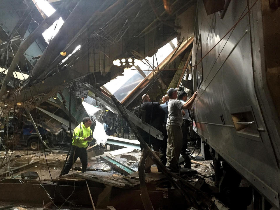 <p>Train personel survey the NJ Transit train that crashed in to the platform at the Hoboken Terminal September 29, 2016 in Hoboken, New Jersey. (Pancho Bernasconi/Getty Images) </p>