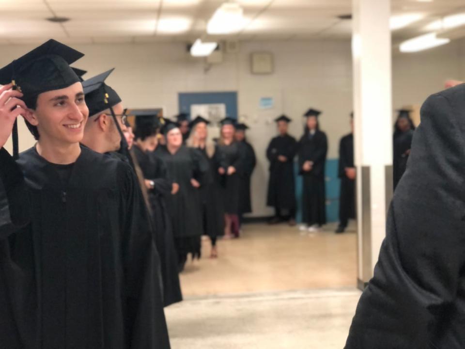 Students from CDC Vimont and CDC Lachute, two adult education centres in the Sir Wilfrid Laurier School Board, prepare for their processional to the graduation stage.