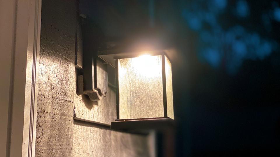 illuminated outdoor porch light sconce fixture