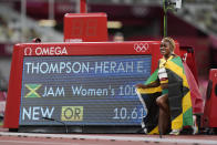 Elaine Thompson-Herah, of Jamaica, celebrates after winning the women's 100-meter final at the 2020 Summer Olympics, Saturday, July 31, 2021, in Tokyo. (AP Photo/Martin Meissner)