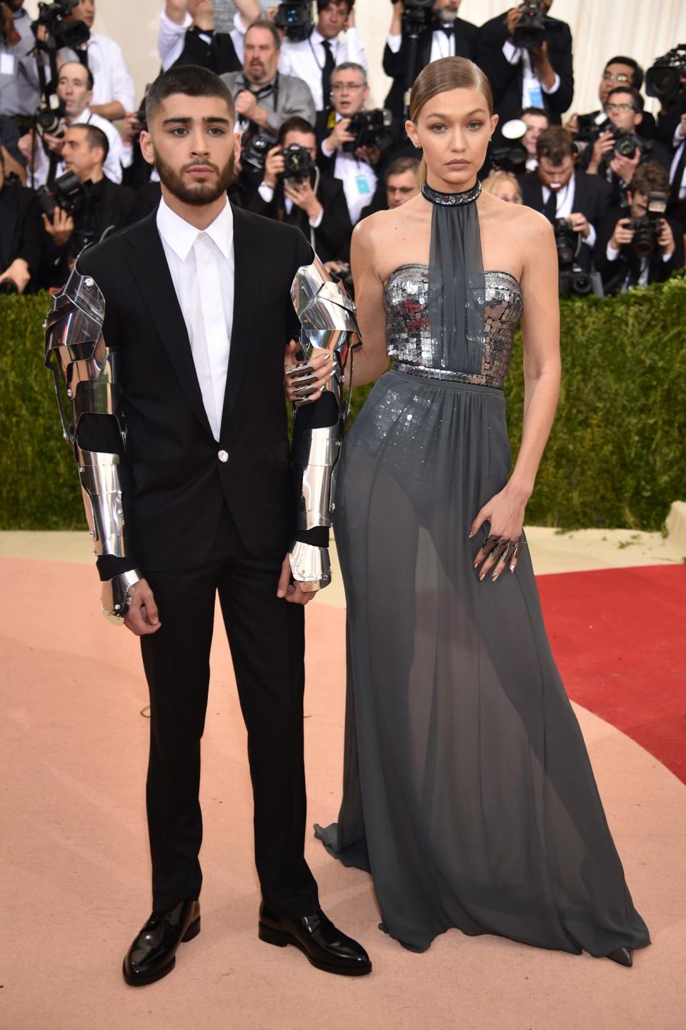 <p>Although Zayn seems slightly uncomfortable on the red carpet, Gigi’s warm smile and clear love of fashion has encouraged him to experiment. <i>[Photo: Getty]</i> </p>