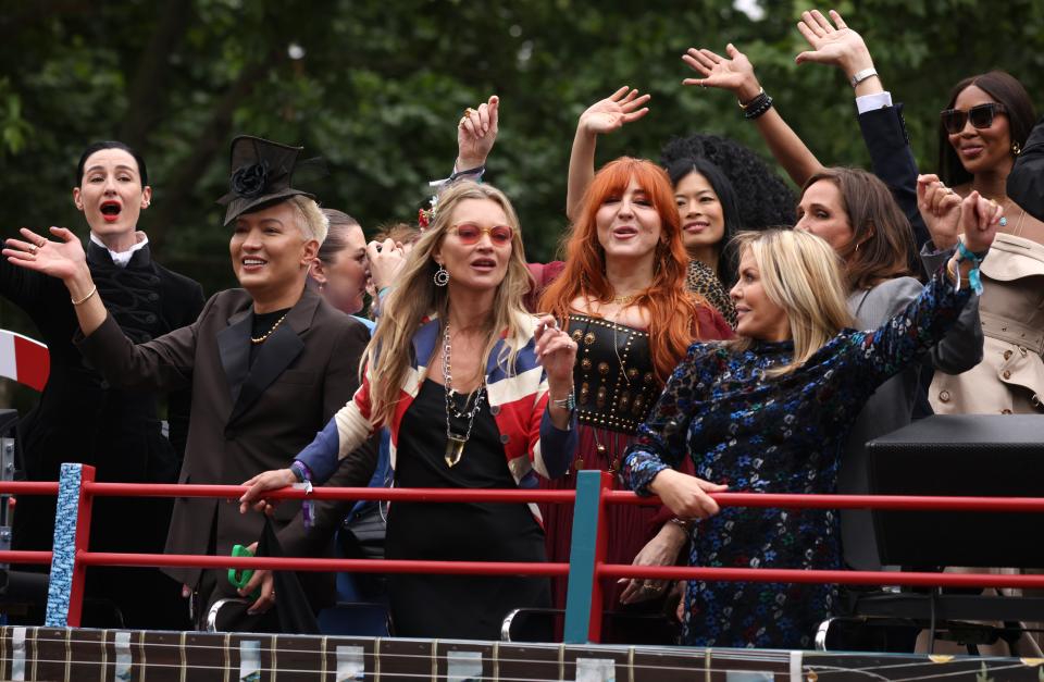 Erin O'Connor, Kate Moss, Charlotte Tilbury and Naomi Campbell wave at attendees (Getty Images)