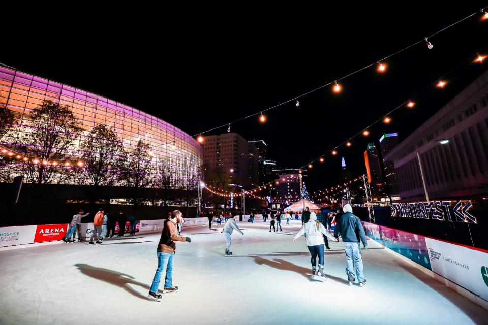 Skaters take to the ice during Arvest Winterfest 2021 outside the BOK Center in Tulsa.