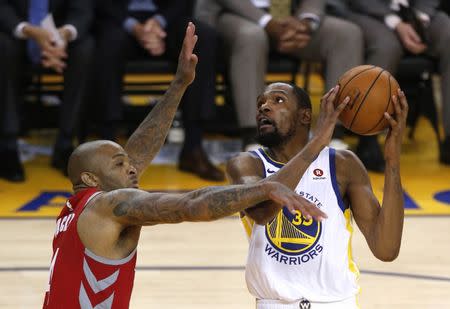 May 26, 2018; Oakland, CA, USA; Golden State Warriors forward Kevin Durant (35) shoots against Houston Rockets forward PJ Tucker (4) in game six of the Western conference finals of the 2018 NBA Playoffs at Oracle Arena. Mandatory Credit: Cary Edmondson-USA TODAY Sports