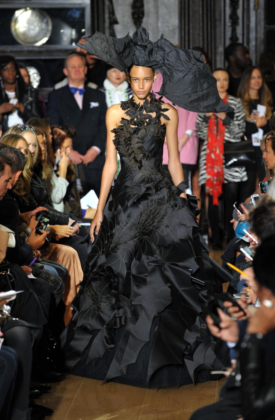 A model wears a design created by Giles at London Fashion Week Spring/Summer 2014 on Monday Sept. 16, 2013 at Stationers' Hall, London. (Photo by Richard Chambury/Invision/AP Images)