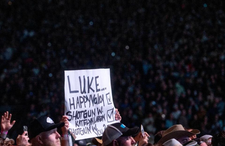 Fans hold up a signs and sign along to Luke Combs during his performance at Beaver Stadium on Saturday, April 27, 2024. Abby Drey/adrey@centredaily.com