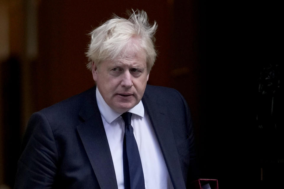 British Prime Minister Boris Johnson leaves 10 Downing Street to attend the weekly Prime Minister's Questions at the Houses of Parliament, in London, Wednesday, Oct. 20, 2021. (AP Photo/Matt Dunham)