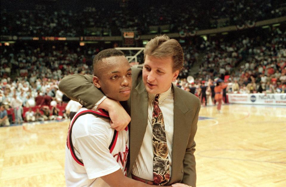 Cincinnati's coach Bob Huggins embraces senior guard Nick Van Exel after the Bearcats defeated Virginia 71-54 in a NCAA East Regional semi-final game at the Meadowlands Arena, East Rutherford, N.J., March 26, 1993. (AP Photo/Charles Rex Arbogast)