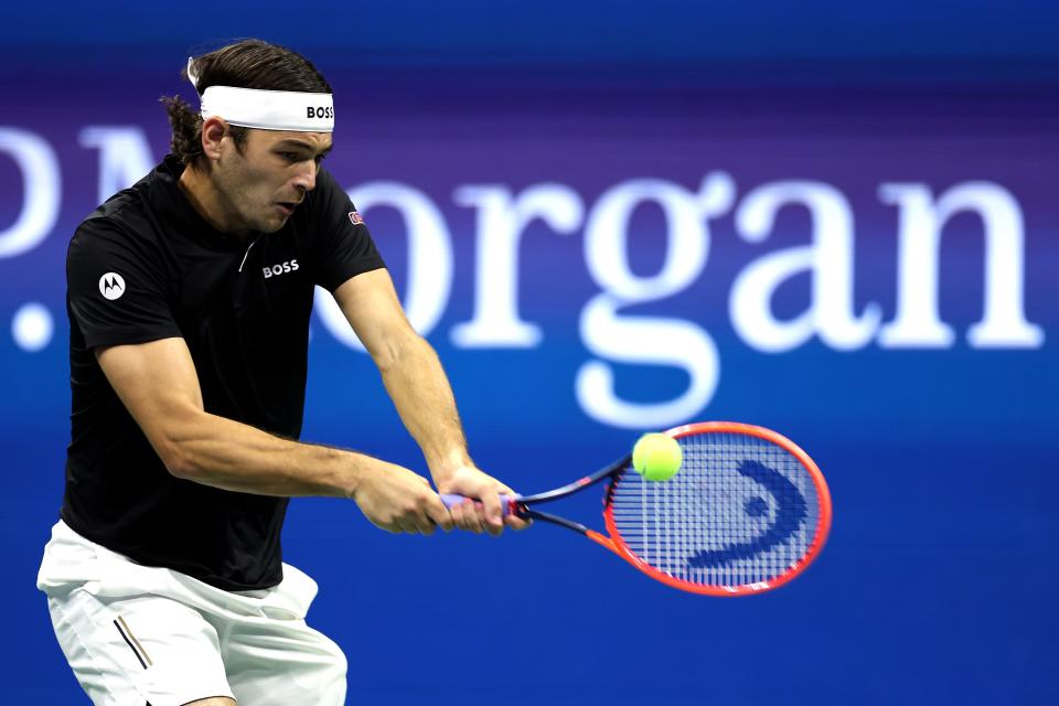 NEW YORK, NEW YORK - SEPTEMBER 06:  Taylor Fritz of the United States returns a shot against Frances Tiafoe of the United States during their Men's Singles Semifinal match on Day Twelve of the 2024 US Open at USTA Billie Jean King National Tennis Center on September 06, 2024 in the Flushing neighborhood of the Queens borough of New York City. (Photo by Sarah Stier/Getty Images) (Getty Images)