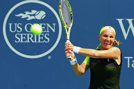 Aug 17, 2017; Mason, OH, USA; Svetlana Kuznetsova (RUS) returns a shot against Carla Suárez Navarro (ESP) during the Western and Southern Open at the Lindner Family Tennis Center. Aaron Doster-USA TODAY Sports