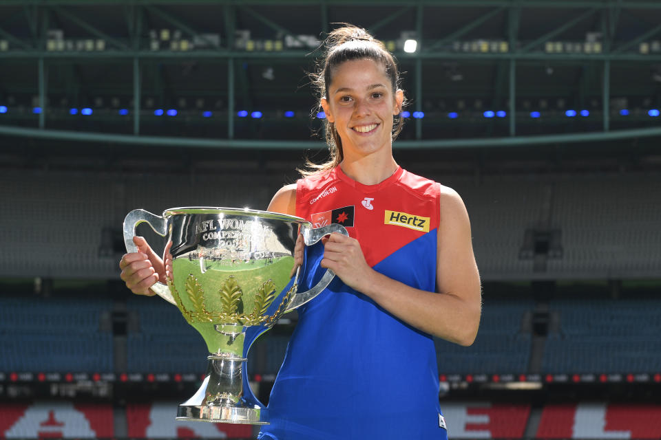 Lauren Pearce of the Melbourne Demons, pictured here with the grand final cup during an AFLW media opportunity at Marvel Stadium.