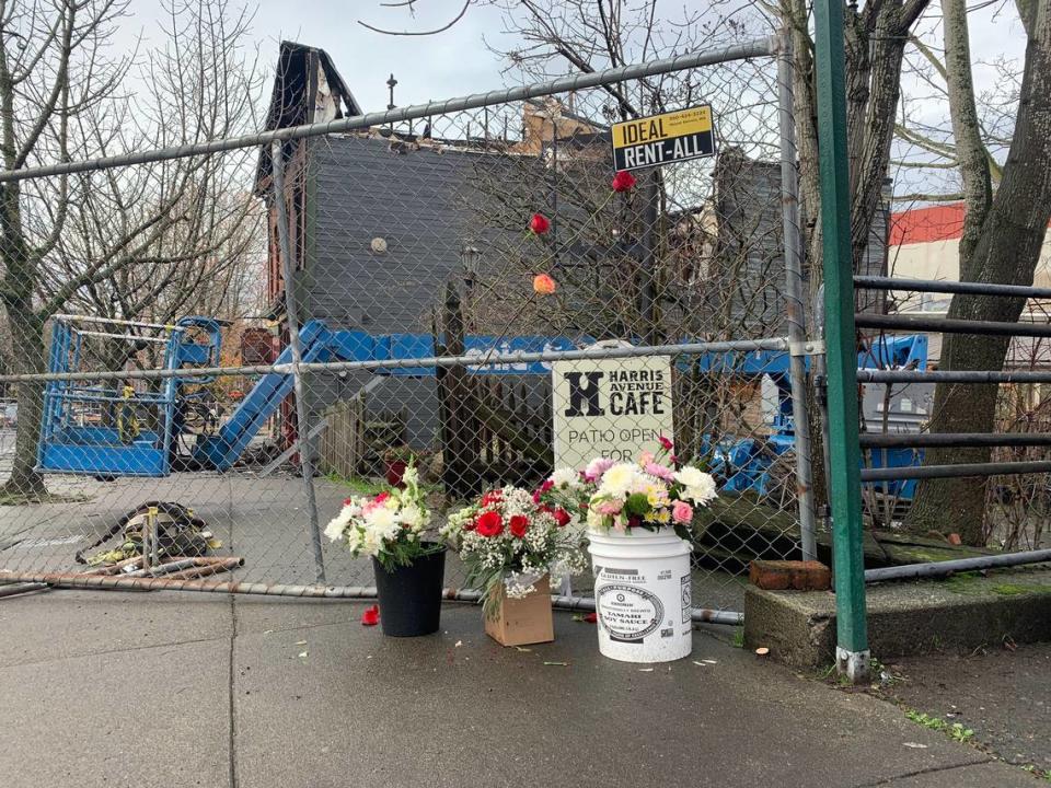 A makeshift memorial began to form on Tuesday, Dec. 19, 2023, outside of the historic Fairhaven Terminal Building that was destroyed by a fire on Sunday, Dec. 17, in Bellingham, Wash.