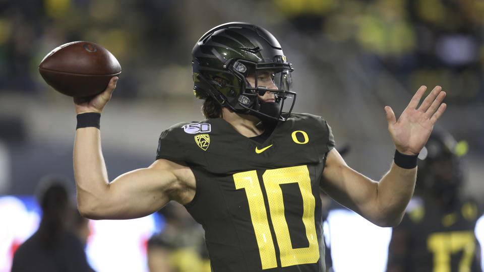 Oregon quarterback Justin Herbert warms up before an NCAA college football game Washington State Saturday, Oct. 26, 2019, in Eugene, Ore. (AP Photo/Chris Pietsch)