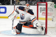 Edmonton Oilers goaltender Mike Smith makes a glove save during the second period in Game 6 of an NHL hockey Stanley Cup first-round playoff series against the Los Angeles Kings Thursday, May 12, 2022, in Los Angeles. (AP Photo/Mark J. Terrill)