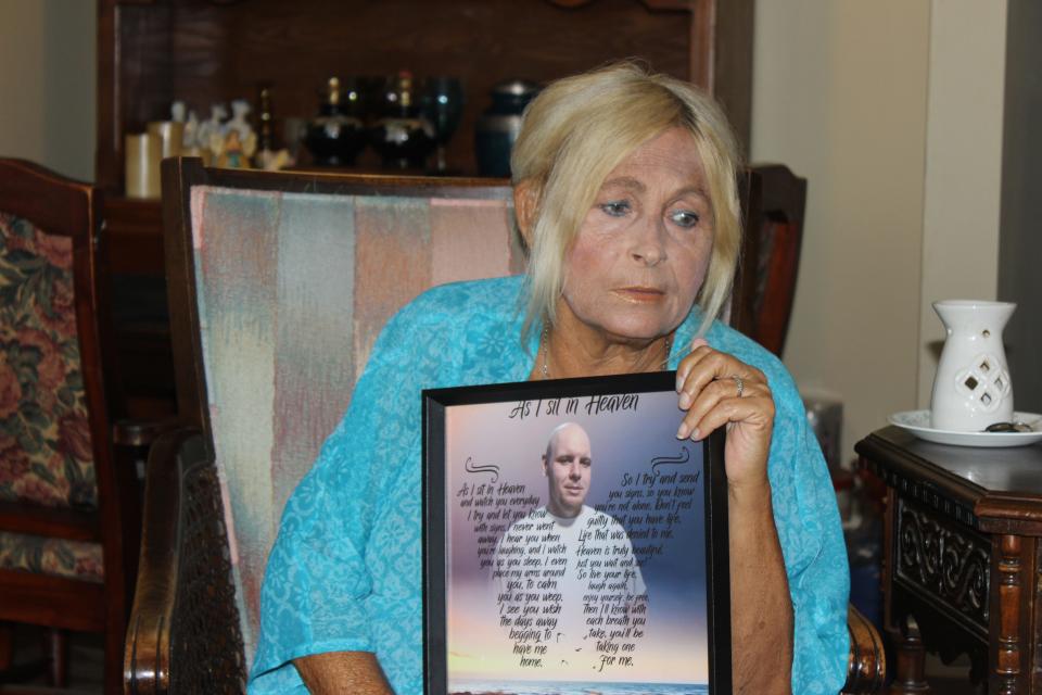 Penny Meade holds a photo of her son Jeremiah Shane Fields who died at a Ballad Health hospital in 2019. The Centers for Medicaid & Medicare Services investigated the death and found Fields’ care was not up to standard.