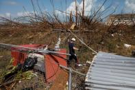 A member of the Canadian Burnaby Firefighters Search & Rescue Task Force searches for victims after Hurricane Dorian hit the Abaco Islands in Marsh Harbour